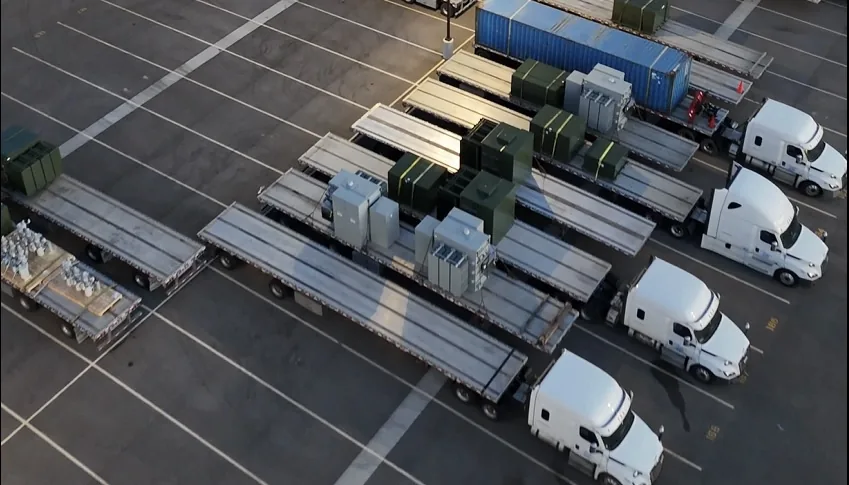 Rows of parked trucks silhouetted at sunset on RT Group's Zion, IL yard