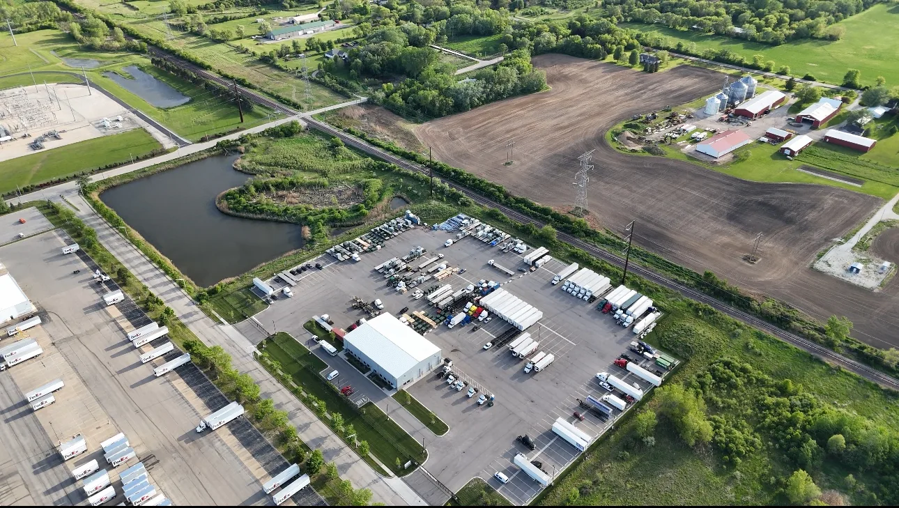 Aerial view of RT Group's paved, fenced truck and trailer parking yard in Zion, IL